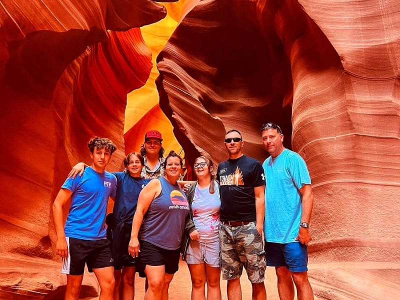 Group posing for photo inside Lower Antelope Canyon