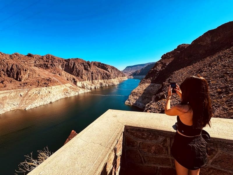 Women taking a photo of Lake Mead at the Hoover Dam
