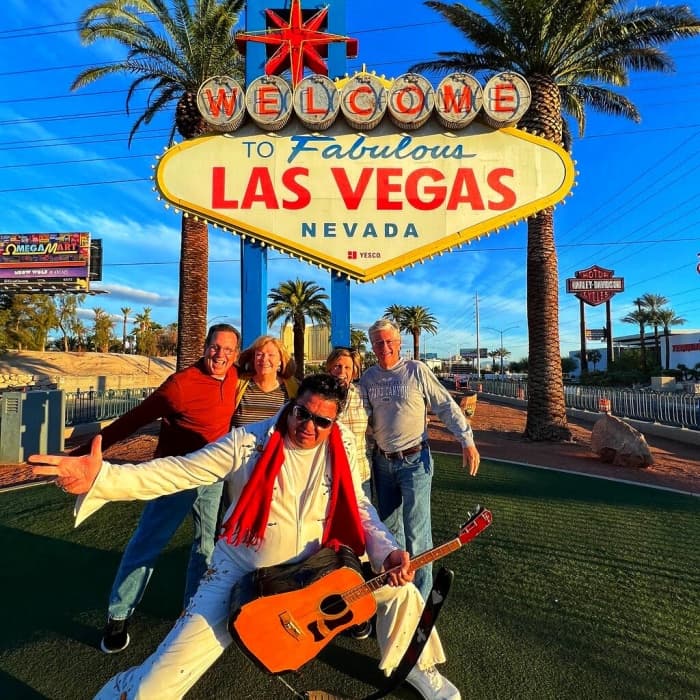 Man dressed as Elvis near Las Vegas sign