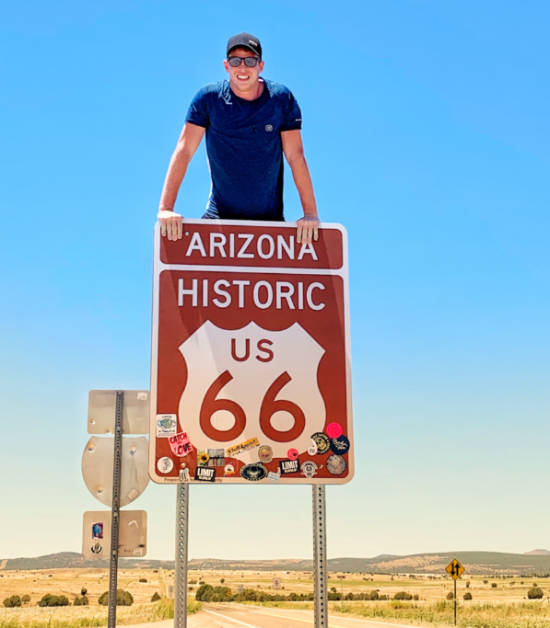 A guy near the legendary Route 66 sign